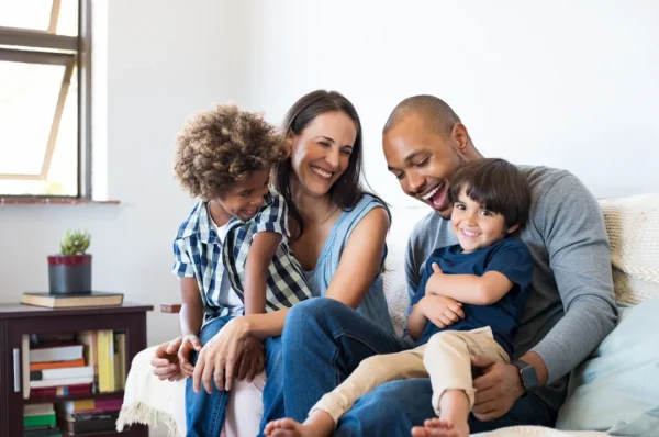 Family having fun on a couch - Keep pests away from your home with General Pest Control in Middleburg Heights